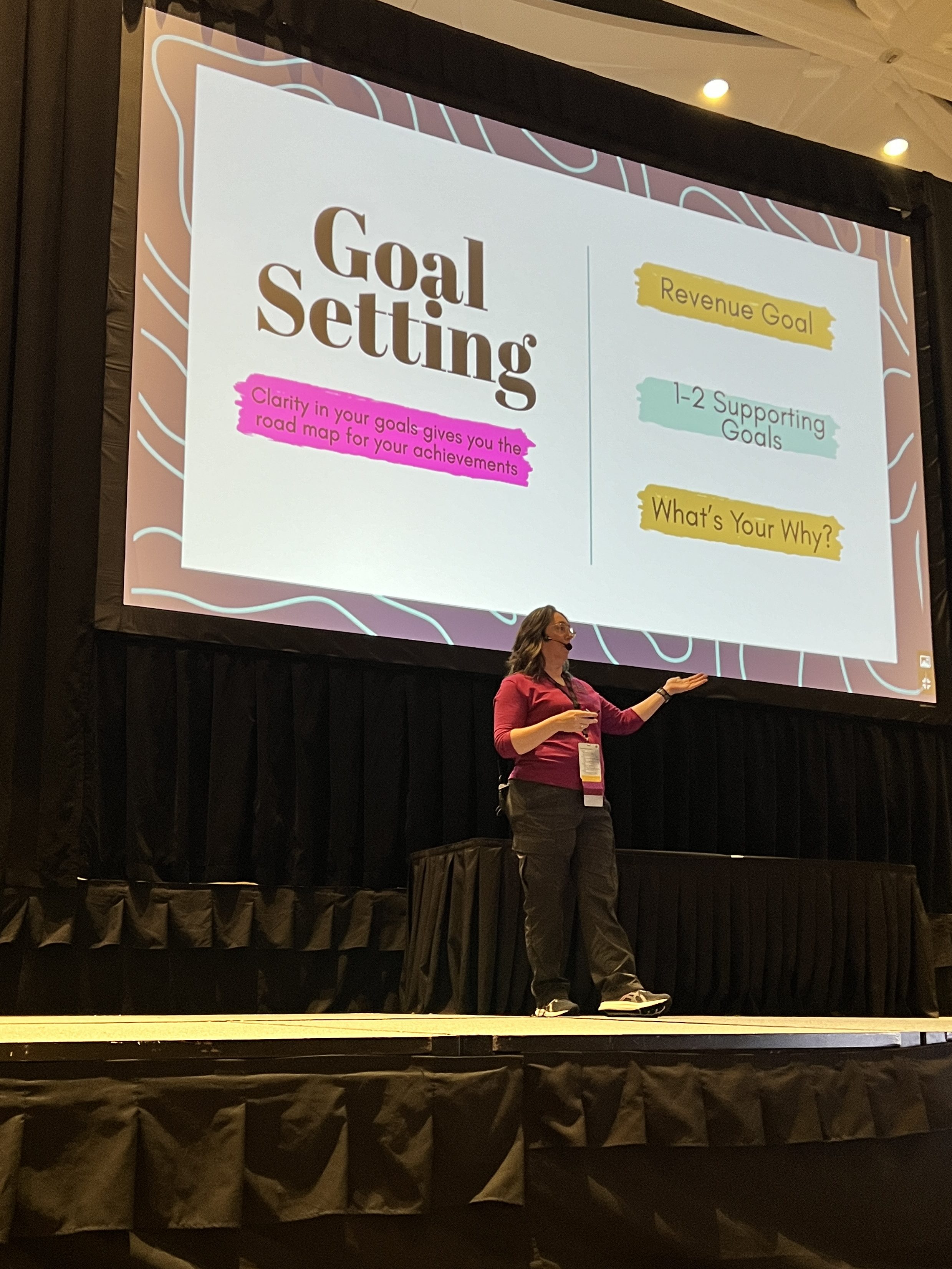 Sara Golding speaking on stage